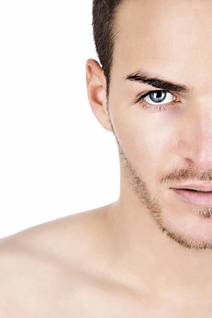 Close-up of a man receiving professional facial treatment at MBody Studio